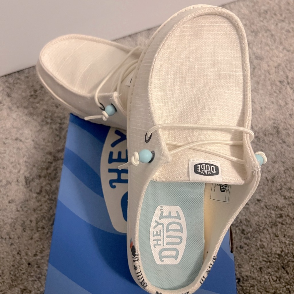 Brand new! Cream Hey Dude mules.
